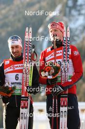 23.01.2010, Antholz, Italy (ITA): (l-r) Vincent Defrasne (FRA), Atomic, Rottefella, One Way, Odlo and Frode Andresen (NOR), Atomic, Swix, Odlo - IBU world cup biathlon, sprint men, Antholz (ITA). www.nordicfocus.com. © Manzoni/NordicFocus. Every downloaded picture is fee-liable.