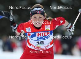 06.01.2010, Cortina-Toblach, Italy (ITA): Marthe Kristoffersen (NOR), Madshus, Rottefella, Swix  - FIS world cup cross-country, tour de ski, 15km women handicap start, Cortina-Toblach (ITA). www.nordicfocus.com. © Hemmersbach/NordicFocus. Every downloaded picture is fee-liable.