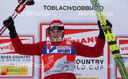 06.01.2010, Cortina-Toblach, Italy (ITA): todays winner and overall leader of the TdS Petter Northug (NOR), Fischer, Rottefella, Alpina, Ski Go, Swix   - FIS world cup cross-country, tour de ski, 30km men handicap start, Cortina-Toblach (ITA). www.nordicfocus.com. © Hemmersbach/NordicFocus. Every downloaded picture is fee-liable.