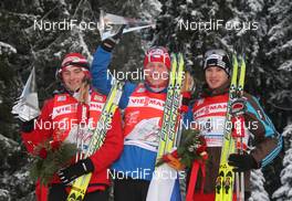 10.01.2010, Val di Fiemme, Italy (ITA): TdS overall podium, l-r: Petter Northug (NOR), Fischer, Rottefella, Alpina, Ski Go, Swix, Lukas Bauer (CZE), Fischer, Rottefella, Alpina, Swix, Toko abd Dario Cologna (SUI), Fischer, Rottefella, Alpina, Swix, adidas  - FIS world cup cross-country, tour de ski, final climb men, Val di Fiemme (ITA). www.nordicfocus.com. © Hemmersbach/NordicFocus. Every downloaded picture is fee-liable.
