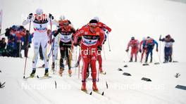 09.01.2010, Val di Fiemme, Italy (ITA): Dario Cologna (SUI), Fischer, Rottefella, Alpina, Swix, adidas, ahead of a big group - FIS world cup cross-country, tour de ski, mass men, Val di Fiemme (ITA). www.nordicfocus.com. © Felgenhauer/NordicFocus. Every downloaded picture is fee-liable.