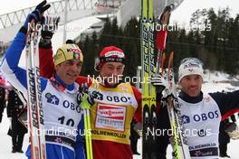 13.03.2010, Holmenkollen, Norway (NOR): podium, l-r: Pietro Piller Cottrer (ITA), Rossignol, Rottefella, One Way, Yoko, Petter Northug (NOR), Fischer, Rottefella, Alpina, Ski Go, Swix, Vincent Vittoz (FRA), Rossignol, Rottefella, One Way, Odlo  - FIS world cup cross-country, 50km men, Holmenkollen (NOR). www.nordicfocus.com. © Hemmersbach/NordicFocus. Every downloaded picture is fee-liable.