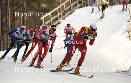 20.03.2010, Falun, Sweden (SWE): l-r: Dario Cologna (SUI), Fischer, Rottefella, Alpina, Swix, adidas, Petter Northug (NOR), Fischer, Rottefella, Alpina, Ski Go, Swix   - FIS world cup cross-country, pursuit men, Falun (SWE). www.nordicfocus.com. © Felgenhauer/NordicFocus. Every downloaded picture is fee-liable.