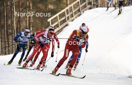 20.03.2010, Falun, Sweden (SWE): l-r: Dario Cologna (SUI), Fischer, Rottefella, Alpina, Swix, adidas, Petter Northug (NOR), Fischer, Rottefella, Alpina, Ski Go, Swix   - FIS world cup cross-country, pursuit men, Falun (SWE). www.nordicfocus.com. Â© Felgenhauer/NordicFocus. Every downloaded picture is fee-liable.
