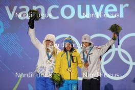 15.02.2010, Whistler, Canada (CAN): l-r: Kristina Smigun (EST), Fischer, Rottefella, Charlotte Kalla (SWE), Fischer, Salomon, Swix, Craft, Marit Bjoergen (NOR), Fischer, Rottefella, Swix  - Olympic Winter Games Vancouver 2010, cross-country, medals, Whistler (CAN). www.nordicfocus.com. © NordicFocus. Every downloaded picture is fee-liable.