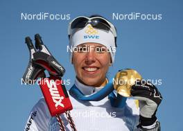 18.02.2010, Whistler, Canada (CAN): medal, Charlotte Kalla (SWE), Fischer, Salomon, Swix, Craft  - Olympic Winter Games Vancouver 2010, cross-country, medals, Whistler (CAN). www.nordicfocus.com. © NordicFocus. Every downloaded picture is fee-liable.
