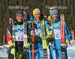 20.02.2010, Whistler, Canada (CAN): podium, l-r: Tobias Angerer (GER), Rossignol, Rottefella, One Way, adidas, Marcus Hellner (SWE), Fischer, Salomon, Exel, Craft, Johan Olsson (SWE), Madshus, Salomon, Leki, Craft  - Olympic Winter Games Vancouver 2010, cross-country, pursuit men, Whistler (CAN). www.nordicfocus.com. © NordicFocus. Every downloaded picture is fee-liable.