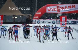 21.11.2010, Gaellivare, Sweden (SWE): start, first row, l-r: Jens Filbrich (GER), Rossignol, Rottefella, One Way, adidas, Evgeniy Belov (RUS), Toni Livers (SUI), Rossignol, Rottefella, Swix, Odlo, Mats Larsson (SWE), Andrew Newell (USA), Fischer, Salomon Salomon, One Way, Craft - FIS world cup cross-country, 4x10km men, Gaellivare (SWE). www.nordicfocus.com. © Hemmersbach/NordicFocus. Every downloaded picture is fee-liable.