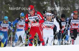 21.11.2010, Gaellivare, Sweden (SWE): Group, in front: Eldar Roenning (NOR), Rossignol, Rottefella, Swix, behind Emil Joensson (SWE), Fischer, Salomon, Craft  - FIS world cup cross-country, 4x10km men, Gaellivare (SWE). www.nordicfocus.com. © Hemmersbach/NordicFocus. Every downloaded picture is fee-liable.