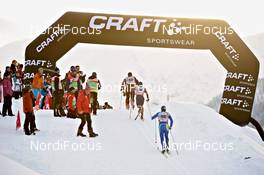 11.12.2010, Davos, Switzerland (SUI): Athletes passing coaches beneath the craft banner - FIS world cup cross-country, 15km men, Davos (SUI). www.nordicfocus.com. Â© Felgenhauer/NordicFocus. Every downloaded picture is fee-liable.