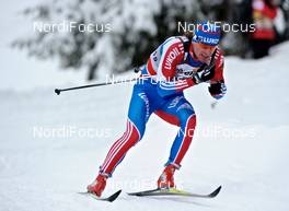 11.12.2010, Davos, Switzerland (SUI): Maxim Vylegzhanin (RUS), Fischer, Rottefella, Alpina, Swix, adidas  - FIS world cup cross-country, 15km men, Davos (SUI). www.nordicfocus.com. Â© Felgenhauer/NordicFocus. Every downloaded picture is fee-liable.