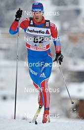 11.12.2010, Davos, Switzerland (SUI): Evgeniy Belov (RUS), Fischer, Alpina, Swix, Adidas  - FIS world cup cross-country, 15km men, Davos (SUI). www.nordicfocus.com. Â© Felgenhauer/NordicFocus. Every downloaded picture is fee-liable.