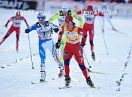 12.12.2010, Davos, Switzerland (SUI): Marit Bjoergen (NOR), Fischer, Rottefella, Swix, ahead of Arianna Follis (ITA), Fischer, Salomon, Swix and Petra Majdic (SLO), Fischer, Rottefella, Alpina, One Way  - FIS world cup cross-country, individual sprint, Davos (SUI). www.nordicfocus.com. Â© Felgenhauer/NordicFocus. Every downloaded picture is fee-liable.