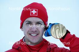 18.02.2010, Whistler, Canada (CAN): medal, Simon Ammann (SUI), Fischer - Olympic Winter Games Vancouver 2010, ski jumping, medals, Whistler (CAN). www.nordicfocus.com. © NordicFocus. Every downloaded picture is fee-liable.