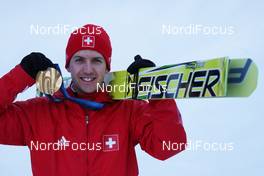 18.02.2010, Whistler, Canada (CAN): medal, Simon Ammann (SUI), Fischer - Olympic Winter Games Vancouver 2010, ski jumping, medals, Whistler (CAN). www.nordicfocus.com. © NordicFocus. Every downloaded picture is fee-liable.