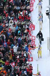 18.12.2010, Engelberg, Switzerland (SUI): Feature: Athletes pass the crowd - FIS world cup ski jumping, individual HS137, Engelberg (SUI). www.nordicfocus.com. © Manzoni/NordicFocus. Every downloaded picture is fee-liable.