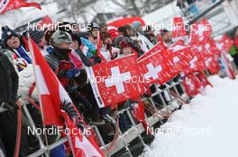 18.12.2010, Engelberg, Switzerland (SUI): Fans with swiss flags - FIS world cup ski jumping, individual HS137, Engelberg (SUI). www.nordicfocus.com. © Manzoni/NordicFocus. Every downloaded picture is fee-liable.