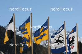 14.03.2010, Scuol, Switzerland (SUI): Flags in the wind - FIS Marathon Cup Engadin Skimarathon, Scuol (SUI). www.nordicfocus.com. © Manzoni/NordicFocus. Every downloaded picture is fee-liable.