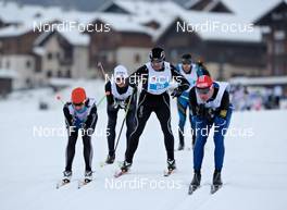 17.12.2010, Livigno, Italy (ITA): Natalia Zernova (RUS), Atomic, Salomon, KV+ (on the very left side), being pushed by a group of men - Skimarathon La Sgambeda Classic, Livigno (ITA). www.nordicfocus.com. Â© Felgenhauer/NordicFocus. Every downloaded picture is fee-liable.