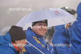 07.01.2011, Oberhof, Germany (GER): Staffan Eklund (SWE), coach Sweden protects himself from heavy rain - IBU world cup biathlon, sprint men, Oberhof (GER). www.nordicfocus.com. © Manzoni/NordicFocus. Every downloaded picture is fee-liable.