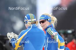21.01.2011, Antholz, Italy (ITA): Helena Ekholm (SWE), Fischer, Rottefella, Leki, adidas and Jenny Jonsson (SWE), Fischer, Rottefella, Leki, adidas - IBU world cup biathlon, sprint women, Antholz (ITA). www.nordicfocus.com. © Manzoni/NordicFocus. Every downloaded picture is fee-liable.