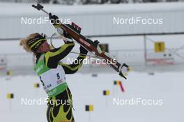 06.02.2011, Presque Isle, United States of America (USA): Marie Dorin (FRA), Rossignol, Rottefella, OneWay - IBU world cup biathlon, pursuit women, Presque Isle (USA). www.nordicfocus.com. © Manzoni/NordicFocus. Every downloaded picture is fee-liable.