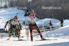 05.02.2011, Presque Isle, United States of America (USA): Kathrin Hitzer (GER), Madshus, Rottefella, Swix, adidas, Marie Laure Brunet (FRA), Rossignol, Rottefella, Swix - IBU world cup biathlon, relay mixed, Presque Isle (USA). www.nordicfocus.com. © Manzoni/NordicFocus. Every downloaded picture is fee-liable.