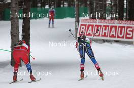 04.02.2011, Presque Isle, United States of America (USA): Biathlon Feature: Athletes enter a downhill - IBU world cup biathlon, sprint women, Presque Isle (USA). www.nordicfocus.com. © Manzoni/NordicFocus. Every downloaded picture is fee-liable.