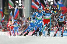12.03.2011, Khanty-Mansiysk, Russia (RUS): Simon Fourcade (FRA), Fischer, Rottefella, Rossignol, Swix, Odlo, Christoph Sumann (AUT), Atomic, Leki , Michael Greis (GER), Madshus, Rottefella, OneWay, adidas - IBU world championships biathlon, mass men, Khanty-Mansiysk (RUS). www.nordicfocus.com. © Manzoni/NordicFocus. Every downloaded picture is fee-liable.
