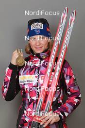 18.03.2011, Khanty-Mansiysk, Russia (RUS): Anais Bescond (FRA), Madshus, Rottefella, Swix, OneWay - IBU world championships biathlon, medals, Khanty-Mansiysk (RUS). www.nordicfocus.com. © Manzoni/NordicFocus. Every downloaded picture is fee-liable.