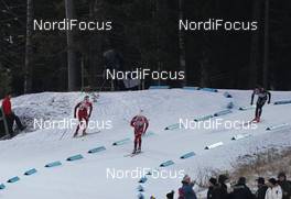 04.12.2011, Oestersund, Sweden (SWE): Tarjei Boe (NOR), Fischer, Rottefella, Swix, ODLO, Lars Berger (NOR), Madshus, Salomon, Swix, Odlo, Benjamin Weger (SUI), Atomic, Leki, Casco, ODLO - IBU world cup biathlon, pursuit men, Oestersund (SWE). www.nordicfocus.com. © Manzoni/NordicFocus. Every downloaded picture is fee-liable.