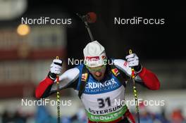 02.12.2011, Oestersund, Sweden (SWE): Dominik Landertinger (AUT), Atomic, Leki - IBU world cup biathlon, sprint men, Oestersund (SWE). www.nordicfocus.com. © Manzoni/NordicFocus. Every downloaded picture is fee-liable.