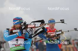17.12.2011, Hochfilzen, Austria (AUT): Olga Zaitseva (RUS), Madshus, Rottefella, Alpina, Swix, adidas Helena Ekholm (SWE), Fischer, Rottefella, Leki, adidas - IBU world cup biathlon, pursuit women, Hochfilzen (AUT). www.nordicfocus.com. © Manzoni/NordicFocus. Every downloaded picture is fee-liable.