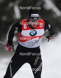 06.01.2011, Cortina-Toblach, Italy (ITA): todays winner Dario Cologna (SUI), Fischer, Rottefella, Alpina, Swix, Odlo  - FIS world cup cross-country, tour de ski, 35km men handicap start, Cortina-Toblach (ITA). www.nordicfocus.com. © Hemmersbach/NordicFocus. Every downloaded picture is fee-liable.