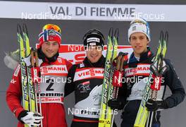 09.01.2011, Val di Fiemme, Italy (ITA): podium Tour de Ski Sprint, l-r: Petter Northug (NOR), Fischer, Rottefella, Alpina, Ski Go, Swix, Dario Cologna (SUI), Fischer, Rottefella, Alpina, Swix, Odlo, Marcus Hellner (SWE), Fischer, Salomon, Exel, Craft  - FIS world cup cross-country, tour de ski, final climb men, Val di Fiemme (ITA). www.nordicfocus.com. © Hemmersbach/NordicFocus. Every downloaded picture is fee-liable.