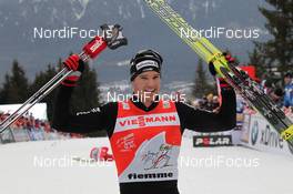 09.01.2011, Val di Fiemme, Italy (ITA): Tour de Ski overall winner Dario Cologna (SUI), Fischer, Rottefella, Alpina, Swix, Odlo  - FIS world cup cross-country, tour de ski, final climb men, Val di Fiemme (ITA). www.nordicfocus.com. © Hemmersbach/NordicFocus. Every downloaded picture is fee-liable.