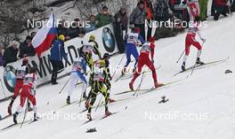 08.01.2011, Val di Fiemme, Italy (ITA): group, in front Alex Harvey (CAN), Fischer, Salomon, Swix, behind Petter Northug (NOR), Fischer, Rottefella, Alpina, Ski Go, Swix  and Lukas Bauer (CZE), Fischer, Rottefella, Alpina, Swix, Toko  - FIS world cup cross-country, tour de ski, mass men, Val di Fiemme (ITA). www.nordicfocus.com. © Hemmersbach/NordicFocus. Every downloaded picture is fee-liable.