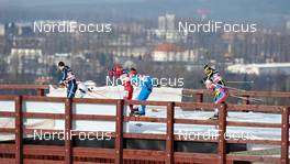 16.01.2011, Liberec, Czech Republic (CZE): a group of men passing the bridge in front of Liberec skyline - FIS world cup cross-country, team sprint, Liberec (CZE). www.nordicfocus.com. © Felgenhauer/NordicFocus. Every downloaded picture is fee-liable.