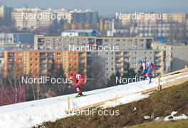 16.01.2011, Liberec, Czech Republic (CZE): l-r: Ola Vigen Hattestad (NOR), Fischer, Rottefella, Swix and Alexander Panzhinskiy (RUS), Rossignol, Swix, adidas in the downhill in front of Liberec skyline - FIS world cup cross-country, team sprint, Liberec (CZE). www.nordicfocus.com. © Felgenhauer/NordicFocus. Every downloaded picture is fee-liable.
