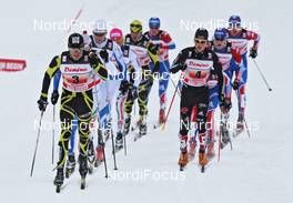 06.02.2011, Rybinsk, Russia (RUS): group, in front, l-r: Maurice Manificat (FRA), Fischer, Swix, One Way, and Andy Kuehne (GER), Rossignol, Rottefella, Leki, Adidas  - FIS world cup cross-country, 4x10km men, Rybinsk (RUS). www.nordicfocus.com. © Hemmersbach/NordicFocus. Every downloaded picture is fee-liable.