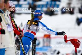 12.03.2011, Lahti, Finland (FIN): Arianna Follis (ITA), Fischer, Swix, Salomon thowing her drink belt away just before the flower ceremony  - FIS world cup cross-country, pursuit women, Lahti (FIN). www.nordicfocus.com. © Laiho/NordicFocus. Every downloaded picture is fee-liable.