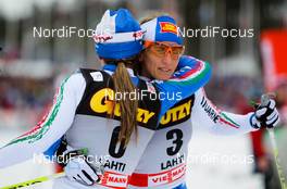 12.03.2011, Lahti, Finland (FIN):  (r-l) Marianna Longa (ITA), Fischer, One Way, Salomon congratulates Arianna Follis (ITA), Fischer, Swix, Salomon - FIS world cup cross-country, pursuit women, Lahti (FIN). www.nordicfocus.com. © Laiho/NordicFocus. Every downloaded picture is fee-liable.