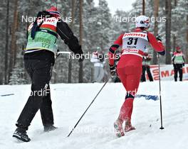 18.03.2011, Falun, Sweden (SWE): Celine Brun-Lie (NOR), Fischer, Rottefella, Alpina, Swix, passing a coach - FIS world cup cross-country, 2,5km women, Falun (SWE). www.nordicfocus.com. © Felgenhauer/NordicFocus. Every downloaded picture is fee-liable.