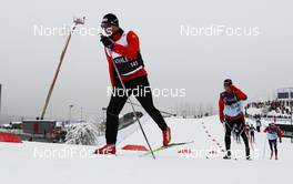 01.03.2011, Oslo, Norway (NOR): Dario Cologna (SUI), Fischer, Swix, Alpina, Rottefella, ODLO, Casco, Toko warming up  - FIS nordic world ski championships, cross-country, 15km men, Oslo (NOR). www.nordicfocus.com. © Laiho/NordicFocus. Every downloaded picture is fee-liable.