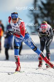 05.03.2011, Oslo, Norway (NOR): Valentina Novikova (RUS), Fischer, Rottefella, Alpina, Adidas, Swix, behind Silvana Bucher (SUI), Rossignol, Alpina, Leki, Odlo  - FIS nordic world ski championships, cross-country, mass  women, Oslo (NOR). www.nordicfocus.com. © Hemmersbach/NordicFocus. Every downloaded picture is fee-liable.