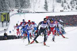 27.02.2011, Oslo, Norway (NOR): group, in front Dario Cologna (SUI), Fischer, Rottefella, Alpina, Swix, Odlo, behind l-r: Roland Clara (ITA), Fischer, Rottefella, Swix, Ivan Babikov (CAN), Salomon, One Way  - FIS nordic world ski championships, cross-country, pursuit men, Oslo (NOR). www.nordicfocus.com. © Hemmersbach/NordicFocus. Every downloaded picture is fee-liable.