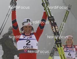 26.02.2011, Oslo, Norway (NOR): Marit Bjoergen (NOR), Fischer, Rottefella, Swix, behind Therese Johaug (NOR), Fischer, Salomon, Swix  - FIS nordic world ski championships, cross-country, pursuit women, Oslo (NOR). www.nordicfocus.com. © Hemmersbach/NordicFocus. Every downloaded picture is fee-liable.