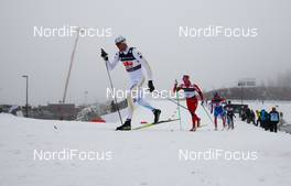 04.03.2011, Oslo, Norway (NOR):  Daniel Rickardsson (SWE), Fischer, Swix, Rottefella, Craft leading ahead of Martin Jonsrud Sundby (NOR), Fischer, KV+, Alpina, Rottefella, Swix - FIS nordic world ski championships, cross-country, 4x10km men, Oslo (NOR). www.nordicfocus.com. © Laiho/NordicFocus. Every downloaded picture is fee-liable.