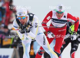 04.03.2011, Oslo, Norway (NOR): Marcus Hellner (SWE), Fischer, Salomon, Exel, Craft, behind Petter Northug (NOR), Fischer, Rottefella, Alpina, Ski Go, Swix   - FIS nordic world ski championships, cross-country, 4x10km men, Oslo (NOR). www.nordicfocus.com. © Hemmersbach/NordicFocus. Every downloaded picture is fee-liable.