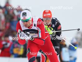 04.03.2011, Oslo, Norway (NOR): in front Petter Northug (NOR), Fischer, Rottefella, Alpina, Ski Go, Swix , behind Tobias Angerer (GER), Rossignol, Rottefella, One Way, adidas  - FIS nordic world ski championships, cross-country, 4x10km men, Oslo (NOR). www.nordicfocus.com. © Hemmersbach/NordicFocus. Every downloaded picture is fee-liable.